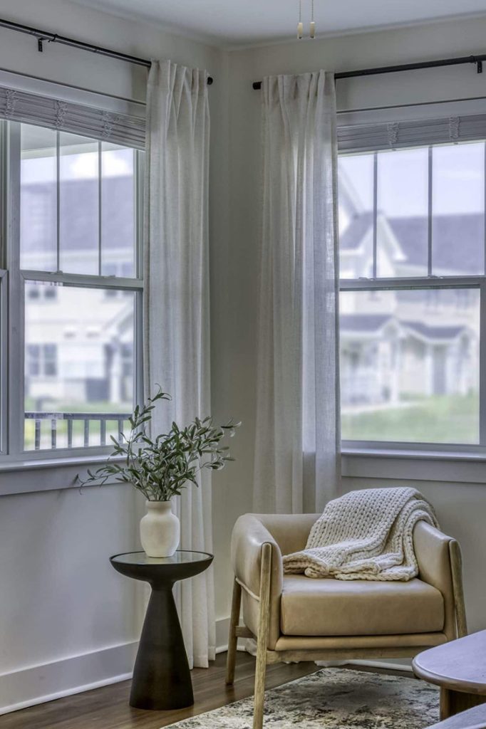 Indiana, Boone County, Lebanon Apartments for rent A cozy corner in one of the new apartments in Lebanon, IN features a beige armchair and a small round table with greenery. Draped with a blanket, it sits by two large windows with sheer curtains, letting natural light spill in along with views of nearby houses. See all available apartments for rent at Hickory Cottages in Indiana Boone County Lebanon, Hickory Cottages has rental units ranging from 664-1420 sq ft