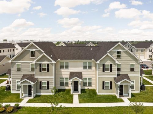 Indiana, Boone County, Lebanon Apartments for rent Two beige and brown multi-family townhouse buildings with small front porches, surrounded by green lawns and sidewalks, under a partly cloudy sky. See all available apartments for rent at Hickory Cottages in Indiana Boone County Lebanon, Hickory Cottages has rental units ranging from 664-1420 sq ft