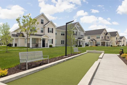 Indiana, Boone County, Lebanon Apartments for rent A modern suburban neighborhood with two-story houses, green lawns, benches, and a bocce ball court under a partly cloudy sky. See all available apartments for rent at Hickory Cottages in Indiana Boone County Lebanon, Hickory Cottages has rental units ranging from 664-1420 sq ft