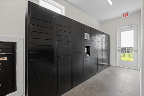 Indiana, Boone County, Lebanon Apartments for rent Black package lockers are arranged along a wall in a well-lit room with concrete floors, a window, and a glass exit door. See all available apartments for rent at Hickory Cottages in Indiana Boone County Lebanon, Hickory Cottages has rental units ranging from 664-1420 sq ft
