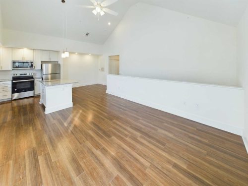Indiana, Boone County, Lebanon Apartments for rent Open-plan kitchen and living area with wood-style flooring, white walls, stainless steel appliances, and a ceiling fan. See all available apartments for rent at Hickory Cottages in Indiana Boone County Lebanon, Hickory Cottages has rental units ranging from 664-1420 sq ft