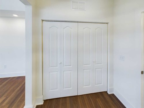 Indiana, Boone County, Lebanon Apartments for rent A closed double-door white closet in a room with white walls and dark wood flooring. See all available apartments for rent at Hickory Cottages in Indiana Boone County Lebanon, Hickory Cottages has rental units ranging from 664-1420 sq ft