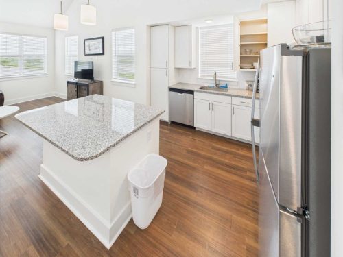 Indiana, Boone County, Lebanon Apartments for rent Modern kitchen with white cabinets, stainless steel appliances, granite island, and wood flooring; windows let in natural light. See all available apartments for rent at Hickory Cottages in Indiana Boone County Lebanon, Hickory Cottages has rental units ranging from 664-1420 sq ft