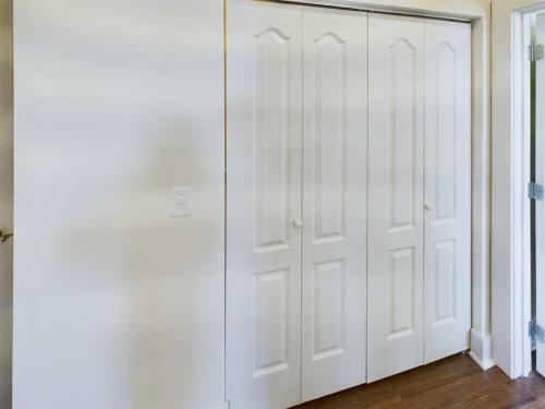 Indiana, Boone County, Lebanon Apartments for rent A white double closet with paneled doors in a room with hardwood flooring. See all available apartments for rent at Hickory Cottages in Indiana Boone County Lebanon, Hickory Cottages has rental units ranging from 664-1420 sq ft