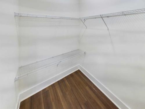 Indiana, Boone County, Lebanon Apartments for rent Empty walk-in closet with white wire shelving and wooden floor. See all available apartments for rent at Hickory Cottages in Indiana Boone County Lebanon, Hickory Cottages has rental units ranging from 664-1420 sq ft